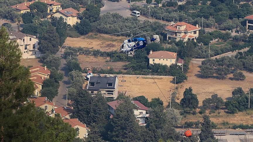 Marmaris'in Turun ve Hisarn Mahallelerinde ormanlk alanna srayan yangna mdahale ediliyor